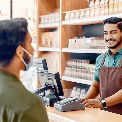 A team member helping a customer in person