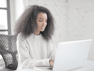 A founder working remotely on a laptop